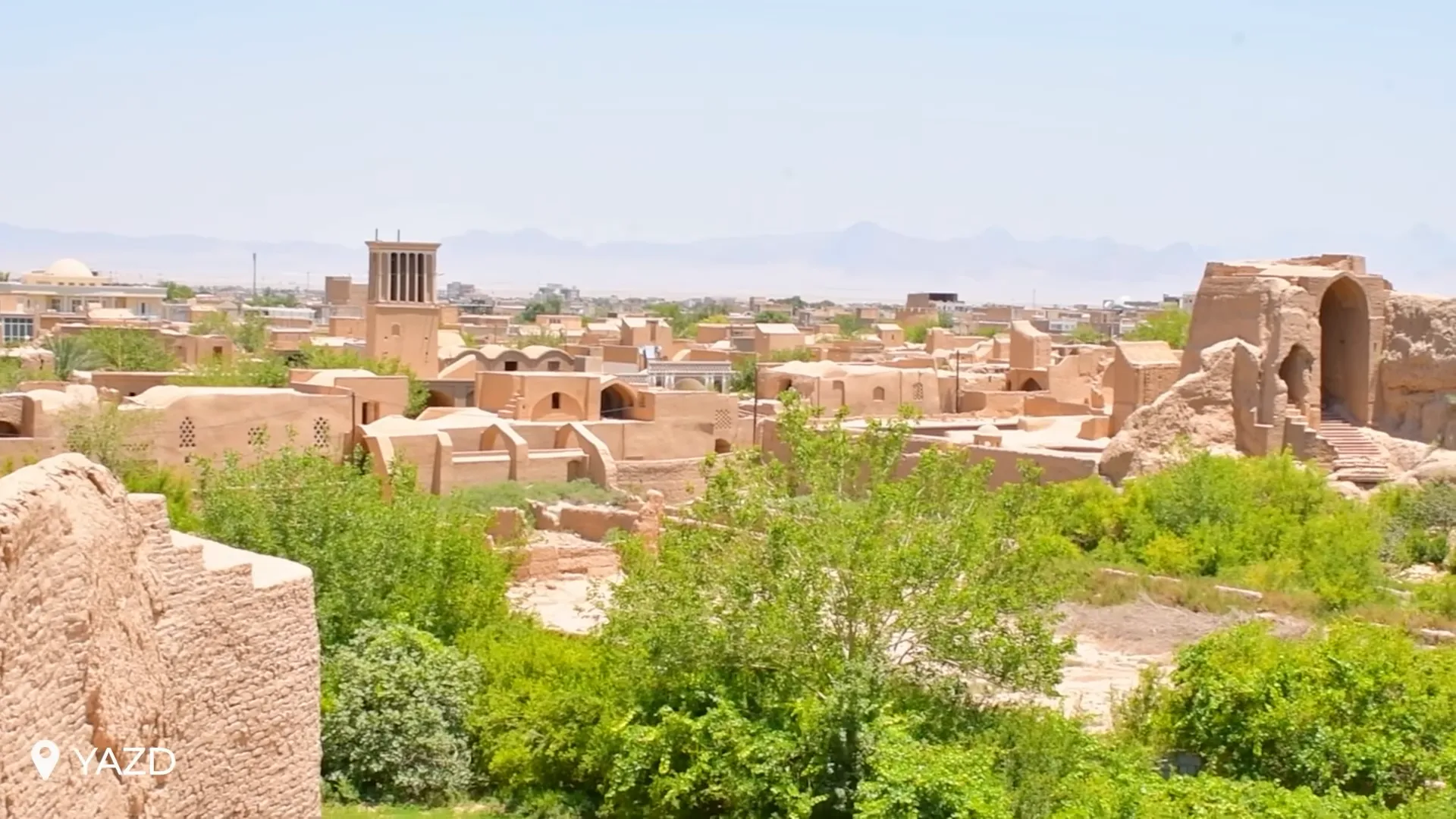 Yazd cityscape with wind towers and desert-colored adobe buildings