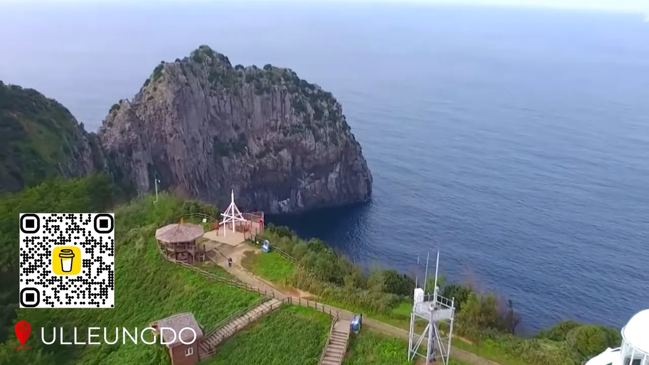 Ulreungdo island cliffs rising out of deep blue sea with dramatic rock formations
