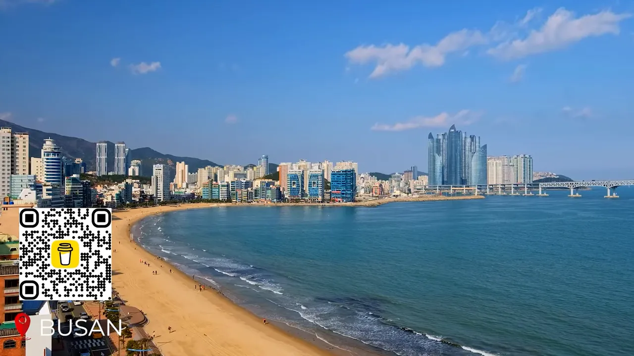 Haeundae Beach with umbrellas, golden sand and families enjoying the sea