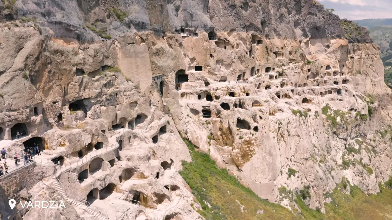 High-resolution close-up of Vardzia cave city showing staircases, walkways and many carved chambers in the cliff