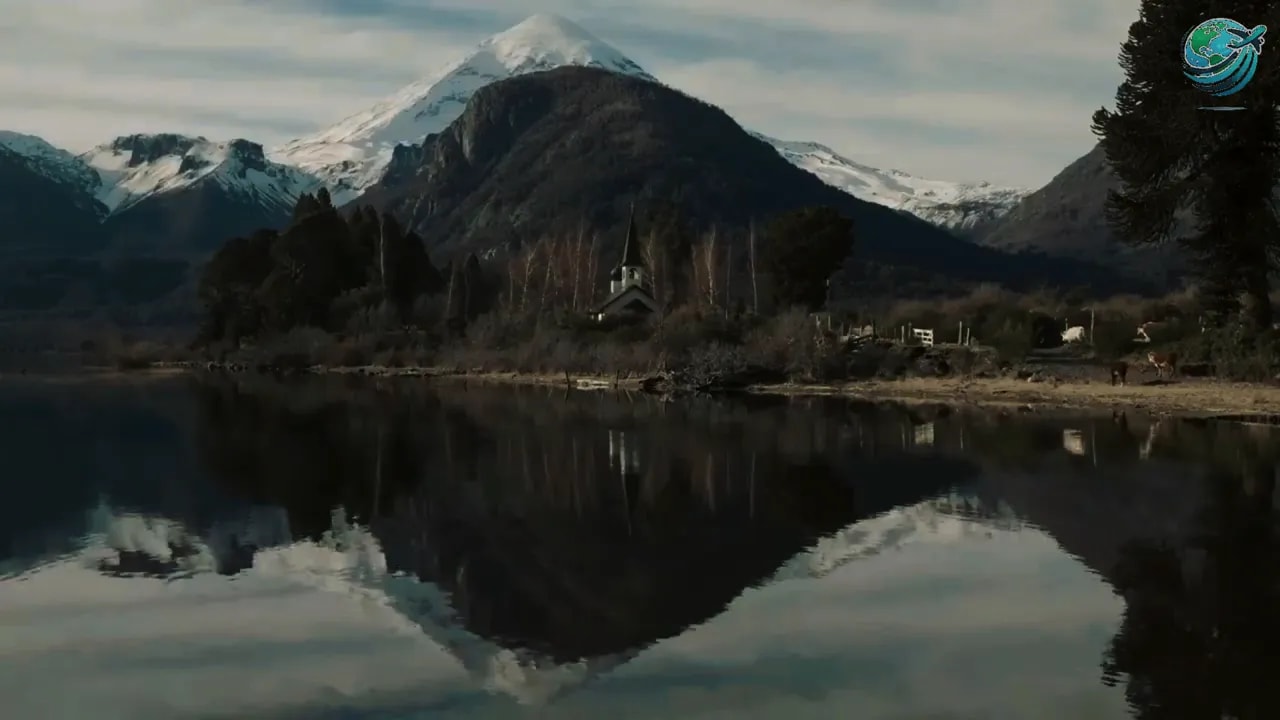 Mountain reflected in a calm lake surrounded by forest